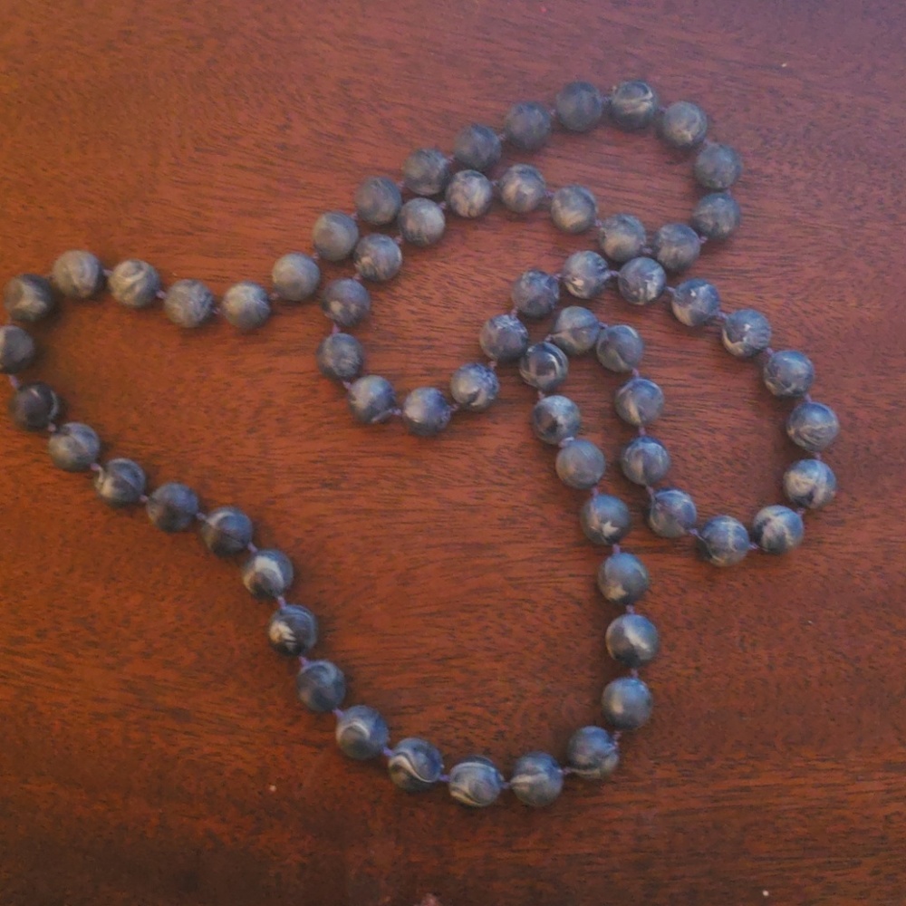 A blue beaded necklace.
